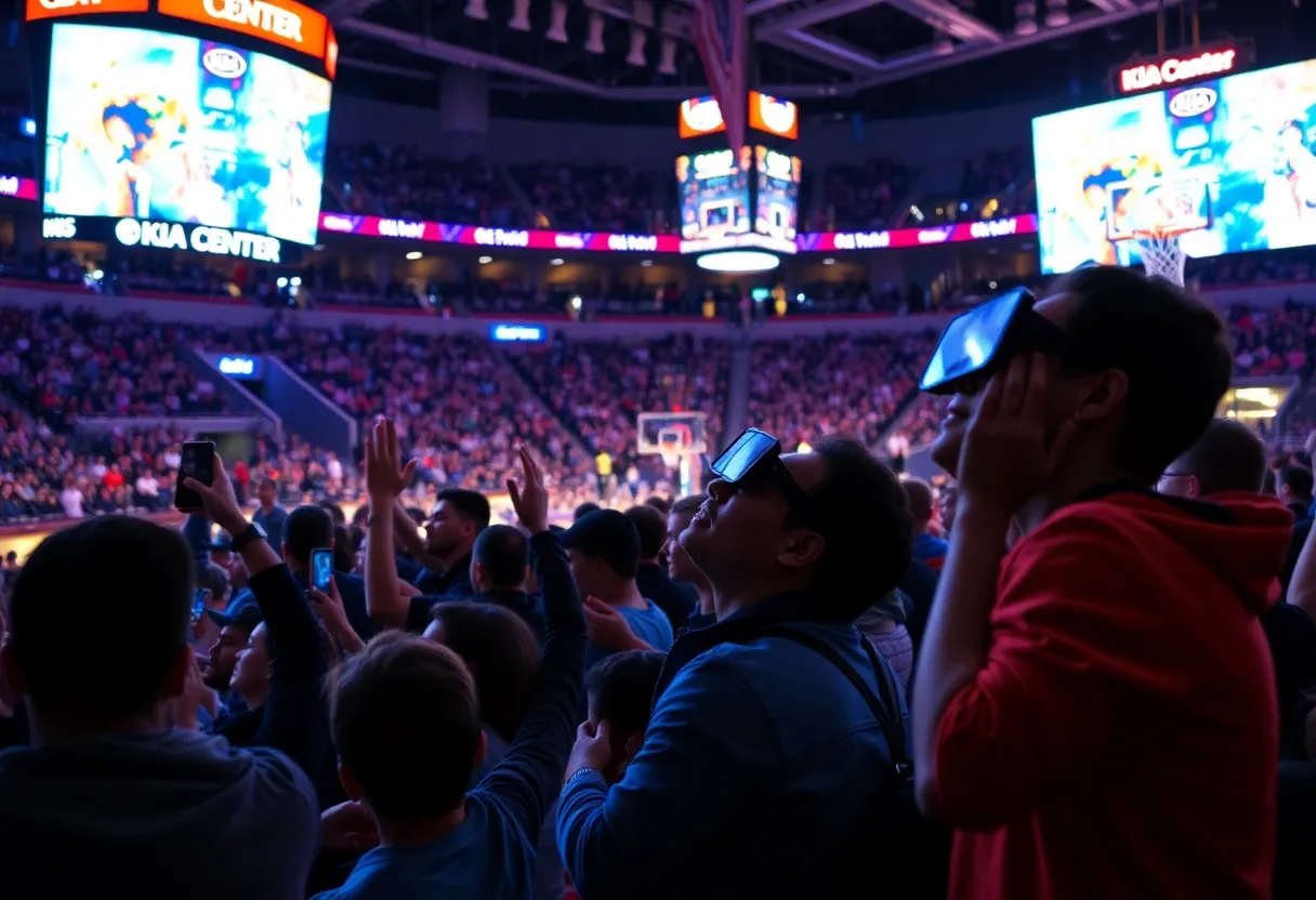 Fans enjoying a basketball game at the Kia Center with technology enhancements