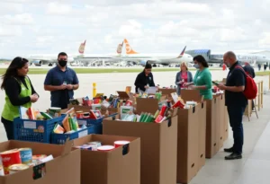 Volunteers at a food drive accepting donations at Orlando Executive Airport.
